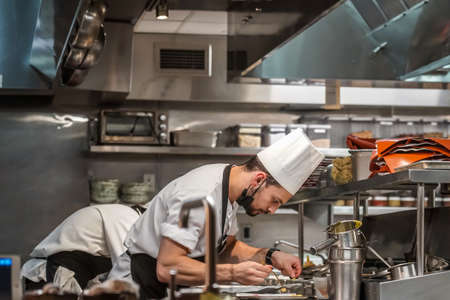 NEW YORK - AUGUST 26, 2021: In the kitchen of Gabriel Kreuther restaurant in Midtown Manhattan. It is Two Star Michelin and Relais & Chateaux award-winning restaurantのeditorial素材
