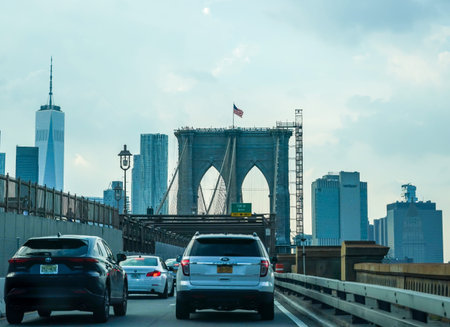 NEW YORK - AUGUST 26, 2021: Crossing the Brooklyn Bridge