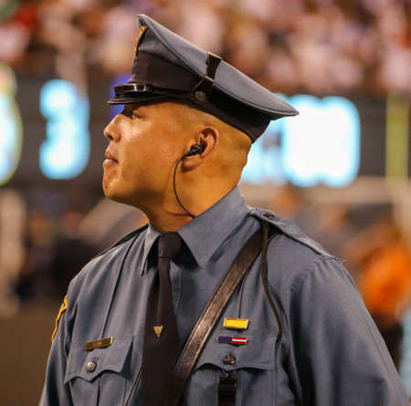 EAST RUTHERFORD, NJ - JULY 26, 2019: New Jersey State Police officer provides security during match Real Madrid vs Atletico de Madrid in the 2019 International Champions Cup at MetLife stadiumのeditorial素材