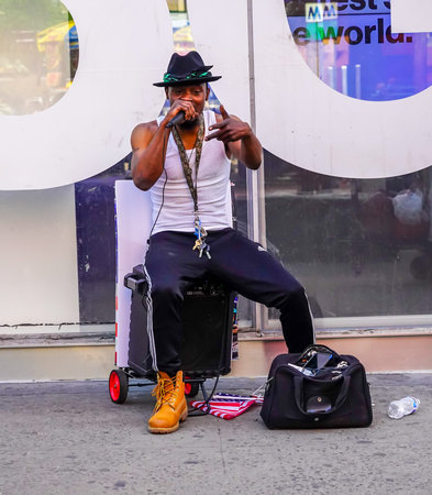 NEW YORK CITY - MAY 2, 2021: Street musician performs at 34th Street in Midtown Manhattan