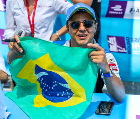 NEW YORK - JULY 14, 2019: Brazilian racing driver Felipe Massa of Venturi Formula E Team signs autographs during 2019 New York City E-Prix at Red Hook in Brooklynのeditorial素材