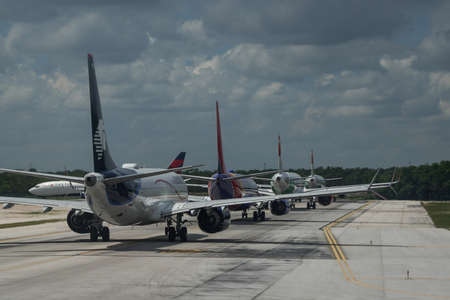 CANCUN, MEXICO - SEPTEMBER 7, 2021: Numerous planes on tarmac at Cancun International Airportのeditorial素材
