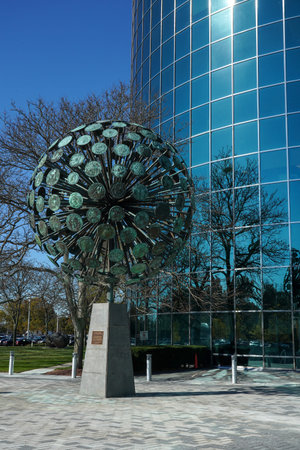 UNIONDALE, NEW YORK - NOVEMBER 8, 2021: Numismatic Sphere by Dorothy Cooper and Harold Caster in Uniondale. At 20 feet tall and weighing 7 tons bronze sphere represents 182 coins from around the worldのeditorial素材