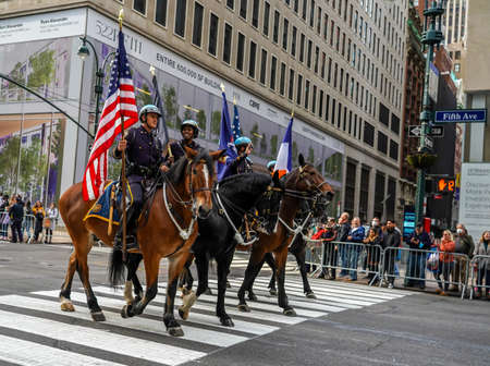 NEW YORK - NOVEMBER 11, 2021: New York City Police Department Mounted Unit officers lead the 102nd Annual Veteran's Day Parade along Fifth Avenue in Manhattanのeditorial素材