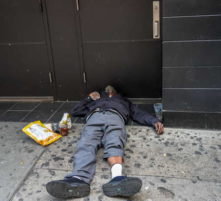 NEW YORK - NOVEMBER 28, 2021: Homeless man near Macy's store in Midtown Manhattanのeditorial素材