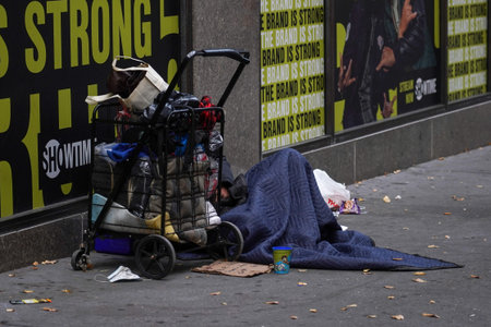 NEW YORK - NOVEMBER 28, 2021: Homeless man near Macy's store in Midtown Manhattan