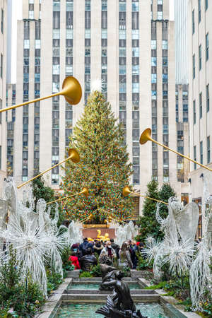 NEW YORK CITY- DECEMBER 5, 2021: Angel Christmas Decorations and Christmas Tree at the Rockefeller Center in Midtown Manhattanのeditorial素材