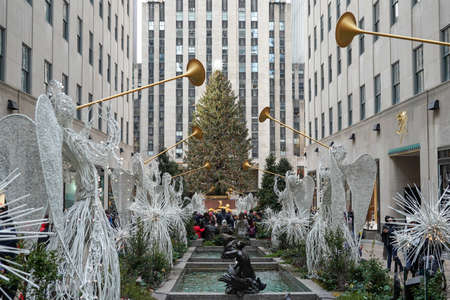 NEW YORK CITY- DECEMBER 5, 2021: Angel Christmas Decorations and Christmas Tree at the Rockefeller Center in Midtown Manhattanのeditorial素材