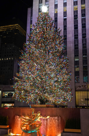 NEW YORK - DECEMBER 4, 2021: Rockefeller Center Christmas Tree and statue of Prometheus at the Lower Plaza of Rockefeller Center in Midtown Manhattanのeditorial素材