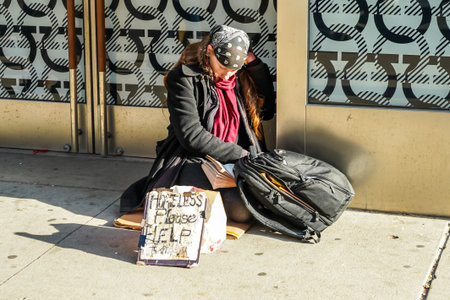 NEW YORK - DECEMBER 5, 2021: Homeless woman at 5th Avenue in Midtown Manhattan