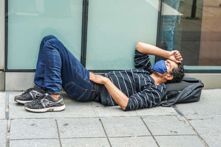 NEW YORK - JULY 22, 2021: Homeless man at 5th Avenue in Midtown Manhattanのeditorial素材