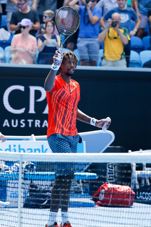 MELBOURNE, AUSTRALIA - JANUARY 24, 2016: Professional tennis player Gael Monfis of France celebrates...
