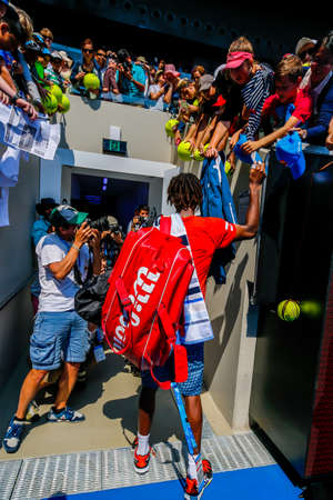 MELBOURNE, AUSTRALIA - JANUARY 24, 2016: Professional tennis player Gael Monfis of France signs autographs at Margaret Court Arena after victory at 2016 Australian Open round 4 match in Melbourne Parkのeditorial素材