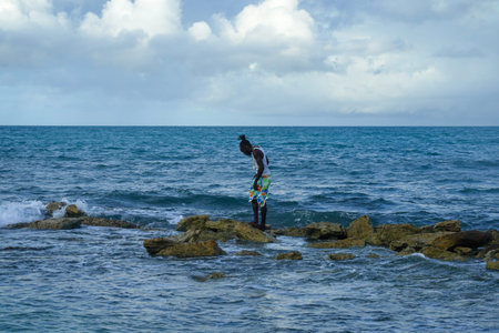 DEEP BAY - ANTIGUA AND BARBUDA, JANUARY 2, 2022: Local resident  at Deep Bay in Antiguaのeditorial素材