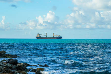 ST. JOHN, ANTIGUA AND BARBUDA - JANUARY 3, 2022: Malcolm General Cargo Ship at anchor in coastal waters of the Antiguaのeditorial素材