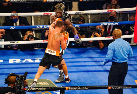NEW YORK - DECEMBER 11, 2021: Vasiliy Lomachenko of Ukraine (black trunks) and Richard Commey...