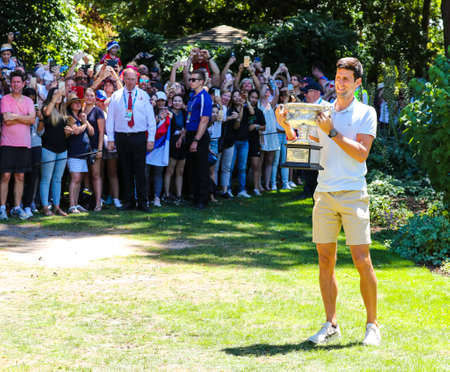 MELBOURNE, AUSTRALIA - JANUARY 28, 2019: 2019 Australian Open champion Novak Djokovic of Serbia posing with Australian Open trophy after his victory at Royal Botanic Gardens Victoria in Melbourneのeditorial素材