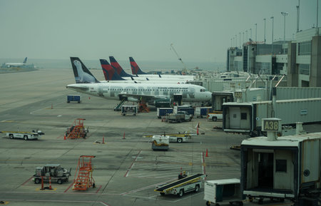 DENVER, COLORADO - AUGUST 7, 2021: Frontier and Delta Airlines planes on tarmac at Denver...