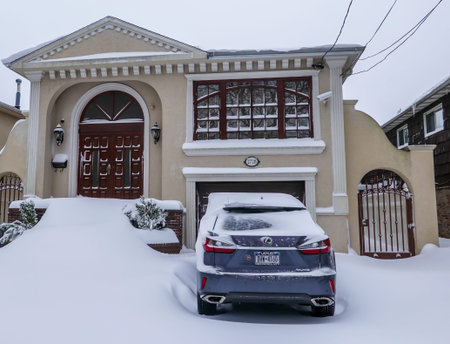 BROOKLYN, NEW YORK - JANUARY 29, 2022: Car under snow in Brooklyn, New York after massive Winter Storm Kenan strikes Northeastのeditorial素材