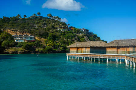 FIVE ISLANDS VILLAGE, ANTIGUA - JANUARY 5, 2022: Overwater Bungalow at the Royalton Antigua Resort, located on the scenic shores of Deep Bayのeditorial素材