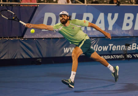 DELRAY BEACH, FLORIDA - FEBRUARY 19, 2022: Professional tennis player Reilly Opelka of United States in action during his semi-final match at the 2022 Delray Beach Open tournament in Floridaのeditorial素材