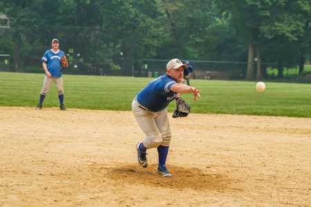 NEW YORK CITY - JULY 20, 2021: Softball teams playing at Heckscher Ballfields in Central Park.There are 26 softball and baseball fields open to the public in Central Parkのeditorial素材