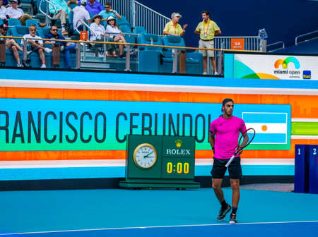 MIAMI GARDENS, FLORIDA - MARCH 30, 2022: Tennis player Francisco Cerundolo of Argentina in action during his quarter-final match at 2022 Miami Open at the Hard Rock Stadium in Miami Gardens, Floridaのeditorial素材