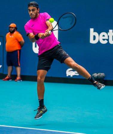 MIAMI GARDENS, FLORIDA - MARCH 30, 2022: Tennis player Francisco Cerundolo of Argentina in action during his quarter-final match at 2022 Miami Open at the Hard Rock Stadium in Miami Gardens, Floridaのeditorial素材