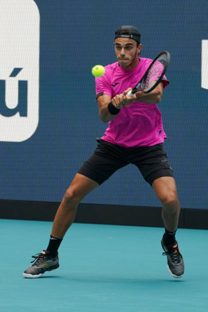 MIAMI GARDENS, FLORIDA - MARCH 30, 2022: Tennis player Francisco Cerundolo of Argentina in action during his quarter-final match at 2022 Miami Open at the Hard Rock Stadium in Miami Gardens, Floridaのeditorial素材