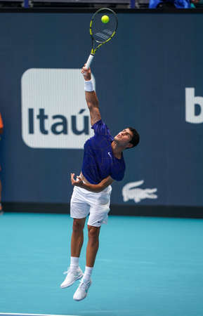 MIAMI GARDENS, FLORIDA - APRIL 3, 2022: Professional tennis player Carlos Alcaraz of Spain in action during his men's final match at 2022 Miami Open at the Hard Rock Stadium in Miami Gardens, Floridaのeditorial素材