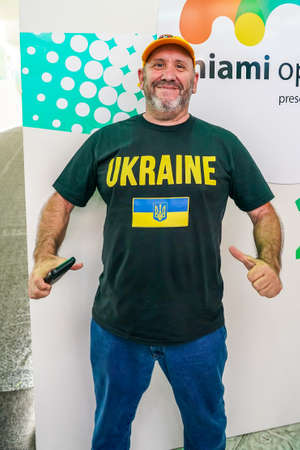 MIAMI GARDENS, FLORIDA - MARCH 31, 2022: Tennis fan supports Ukraine as seen at 2022 Miami Open at the Hard Rock Stadium in Miami Gardens, Floridaのeditorial素材