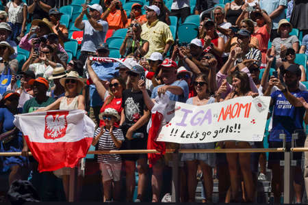 MIAMI GARDENS, FLORIDA - APRIL 2, 2022: Tennis fans holding Polish  flags after Miami Open 2022 women's final match won by Iga Swiatek of Poland at the Hard Rock Stadium in Miami Gardens, Floridaのeditorial素材