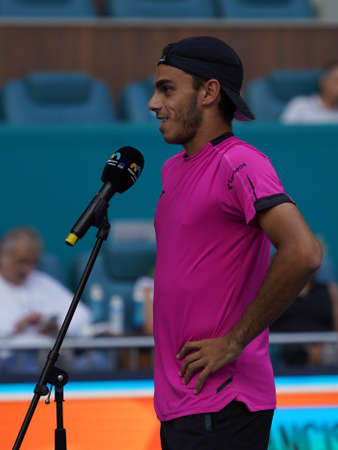MIAMI GARDENS, FLORIDA - MARCH 30, 2022: Tennis player Francisco Cerundolo of Argentina during on court interview after his quarter-final match at 2022 Miami Open at the Hard Rock Stadium in Miamiのeditorial素材