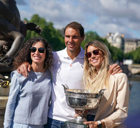 PARIS, FRANCE - JUNE 6, 2022: Roland Garros 2022 Champion Rafael Nadal (center) with his wife Maria Francisca Perello (L) and sister Maria Isabel Nadal posing with trophy in Parisのeditorial素材