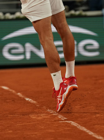 PARIS, FRANCE - MAY 31, 2022: Grand Slam champion Novak Djokovic of Serbia wears custom Asics tennis...