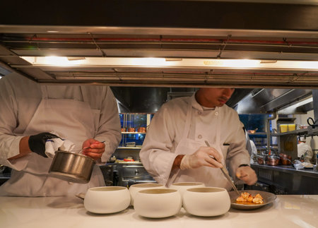 NEW YORK - AUGUST 20, 2022: In a kitchen of a Two Michelin Stars Jean-Georges restaurant by French chef Jean-Georges Vongerichten in Manhattanのeditorial素材