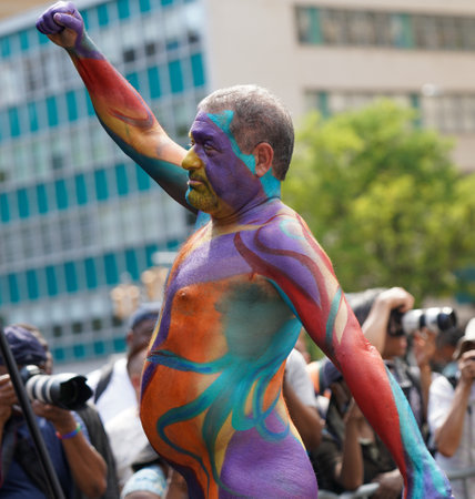 NEW YORK - JULY 24, 2022: Artists paint fully nude models of all shapes and sizes during 9th NYC Body Painting Day featuring artist Andy Golub at Union Square in New Yorkのeditorial素材