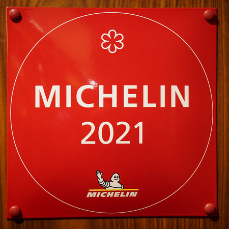 NEW YORK - OCTOBER 23, 2022: One Star Michelin Guide plaque at the Michelin star French restaurant L'Appart at Le District in Battery Park, New York.のeditorial素材