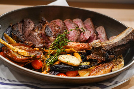 Meat and potatoes dish on cast iron panのeditorial素材