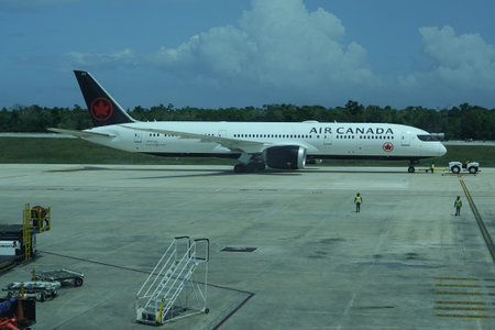 CANCUN, MEXICO - APRIL 26, 2022: Air Canada plane on tarmac at Cancun International Airport. Air Canada is the flag carrier and the largest airline of Canada by the sizeのeditorial素材