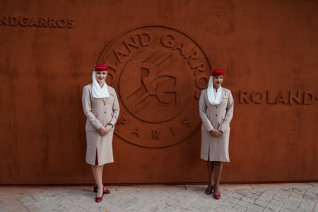 PARIS, FRANCE- MAY 30, 2022: Emirates Airline flight attendants at the Roland Garros 2022 in Paris, France. Emirates is the Official Airline and Premium Partner of the Tournamentのeditorial素材