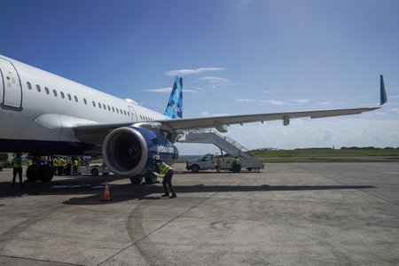 ST. GEORGE, GRENADA - JANUARY 3, 2023: JetBlue plane on tarmac at Maurice Bishop International Airport in Grenadaのeditorial素材