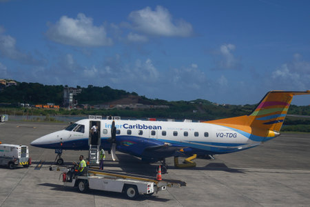 ST. GEORGE, GRENADA - JANUARY 3, 2023: An InterCaribbean Airways Embraer 120 plane on tarmac at Maurice Bishop International Airport in Grenadaのeditorial素材