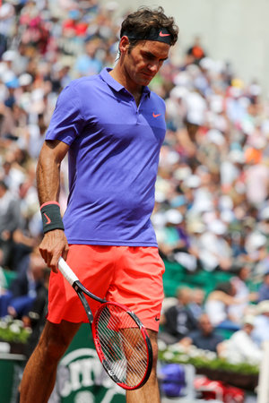 PARIS, FRANCE - MAY 27, 2015: Seventeen times Grand Slam champion Roger Federer in action during his second round match at Roland Garros 2015 in Paris, Franceのeditorial素材