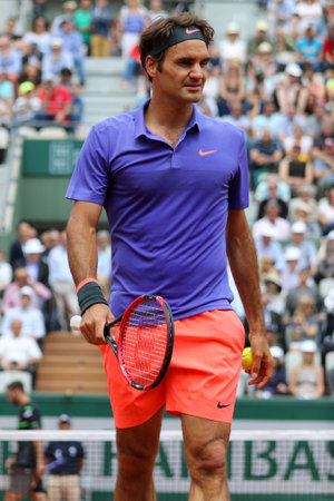 PARIS, FRANCE - MAY 27, 2015: Seventeen times Grand Slam champion Roger Federer in action during his second round match at Roland Garros 2015 in Paris, Franceのeditorial素材