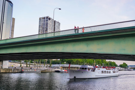 PARIS, FRANCE - JUNE 2, 2022: Seine River cruise under Pont de Grenelle in Paris, Franceのeditorial素材