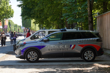 PARIS, FRANCE - JUNE 2, 2022: National police car provides security at the Avenue des Champs-Elysees in Paris.The National Police is the country's main civil law enforcement agencyのeditorial素材