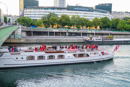 PARIS, FRANCE - JUNE 2, 2022: Seine River cruise under Pont de Grenelle in Paris, Franceのeditorial素材