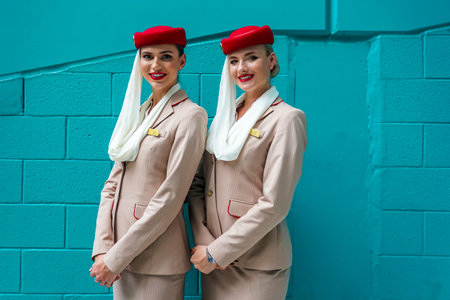 MIAMI GARDENS, FLORIDA - APRIL 3, 2022: Emirates Airlines flight attendants during 2022 Miami Open at the Hard Rock Stadium in Miami Gardens, Floridaのeditorial素材