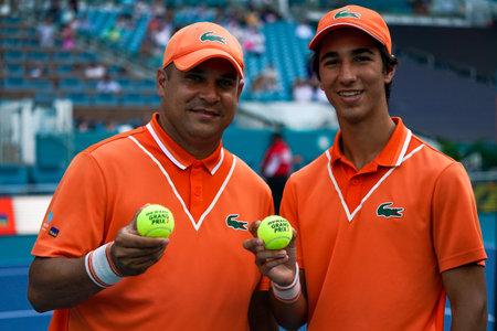 MIAMI GARDENS, FLORIDA - APRIL 1, 2022: Ball boys pose with Miami Open Official tennis ball at the Hard Rock Stadium in Miami Gardens, Florida. Dunlop tennis ball is an official baのeditorial素材